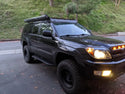Front passenger side view of Toyota 4Runner with Step Edition bolt on rock sliders - Cali Raised LED