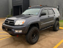 Front drivers side view of gray 4Runner with Trail Edition bolt on rock sliders - Cali Raised LED